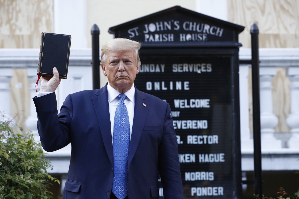 FILE - In this June 1, 2020, file photo President Donald Trump holds a Bible as he visits outside St. John's Church across Lafayette Park from the White House in Washington. (AP Photo/Patrick Sem ...