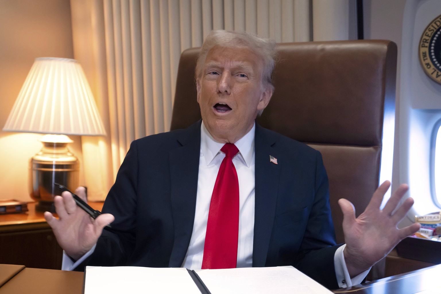 FILE - President Donald Trump speaks to reporters aboard Air Force One as he travels to New Orleans, Feb. 9, 2025. (AP Photo/Ben Curtis, File)
Donald Trump