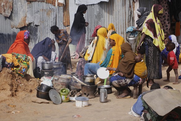 People displaced by floodwater following a heavy downpour takes shelter on the street in Mogadishu, Somalia, Saturday, May 10, 2025. (AP Photo/Farah Abdi Warsameh)
Somalia Floods