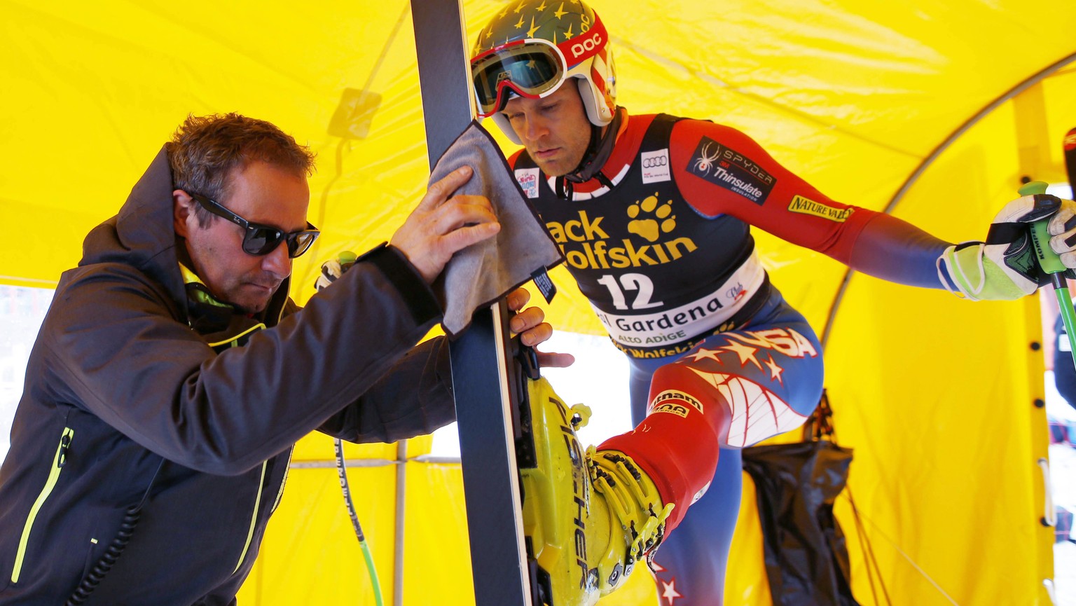 FILE - This Dec. 17, 2015 file photo shows ski technician Leo Mussi working on United States&#039;s Steven Nyman skis during a training session for a men&#039;s World Cup downhill in Val Gardena, Ital ...