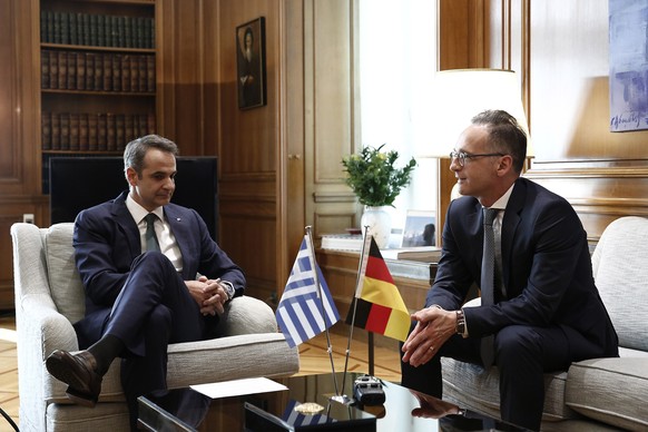 epa08558691 Greek Prime Minister Kyriakos Mitsotakis (L) talks with the German Foreign Minister Heiko Maas during their meeting at Maximos Mansion in Athens, Greece, 21 July 2020. German Foreign Minis ...