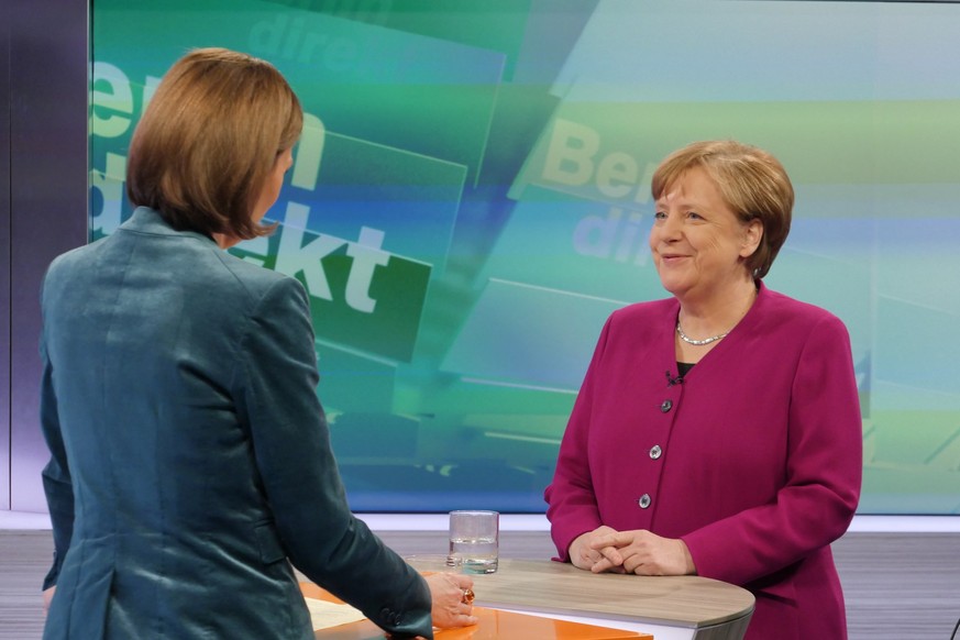 epa06515628 A handout photo made available by the German tv station ZDF shows German Chancellor and Chairwoman of the Christian Democratic Union (CDU), Angela Merkel (R), being interviewed by ZDF jour ...