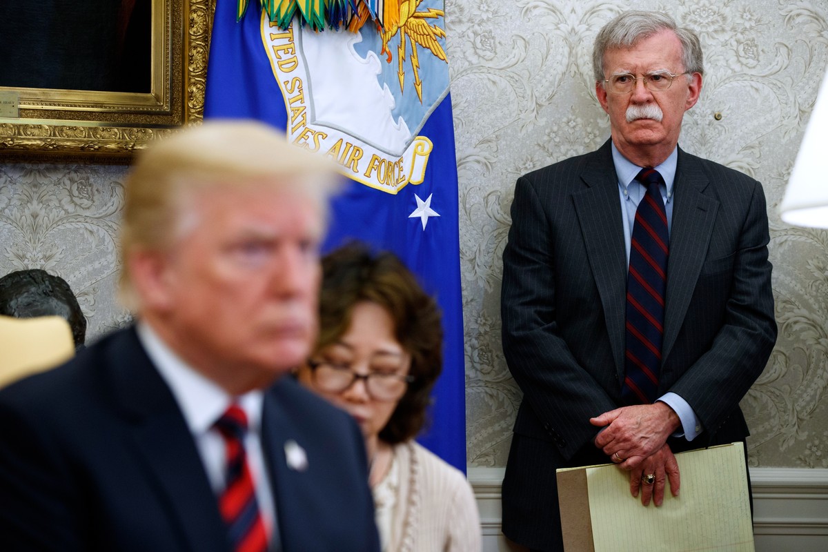 FILE - President Donald Trump meets with South Korean President Moon Jae-In in the Oval Office of the White House, May 22, 2018, in Washington, as national security adviser John Bolton watches. (AP Ph ...