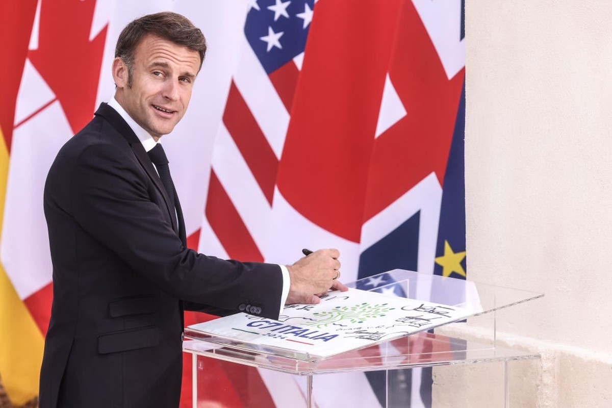 FASANO, ITALY - JUNE 13: French President Emmanuel Macron Signs the G7 guests card during the opening of the G7 Summit at Borgo Egnazia Resort, on June 13, 2024 in Fasano, Italy. (Photo by Alessandra  ...