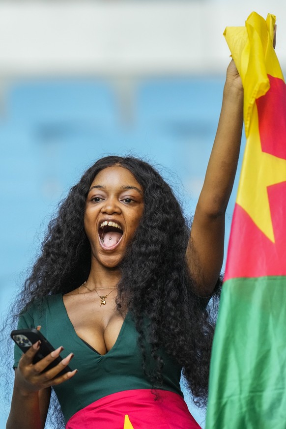 A supporter from Cameroon waves a Cameroon flag during the World Cup group G soccer match between Switzerland and Cameroon, at the Al Janoub Stadium in Al Wakrah, Qatar, Thursday, Nov. 24, 2022. (AP P ...