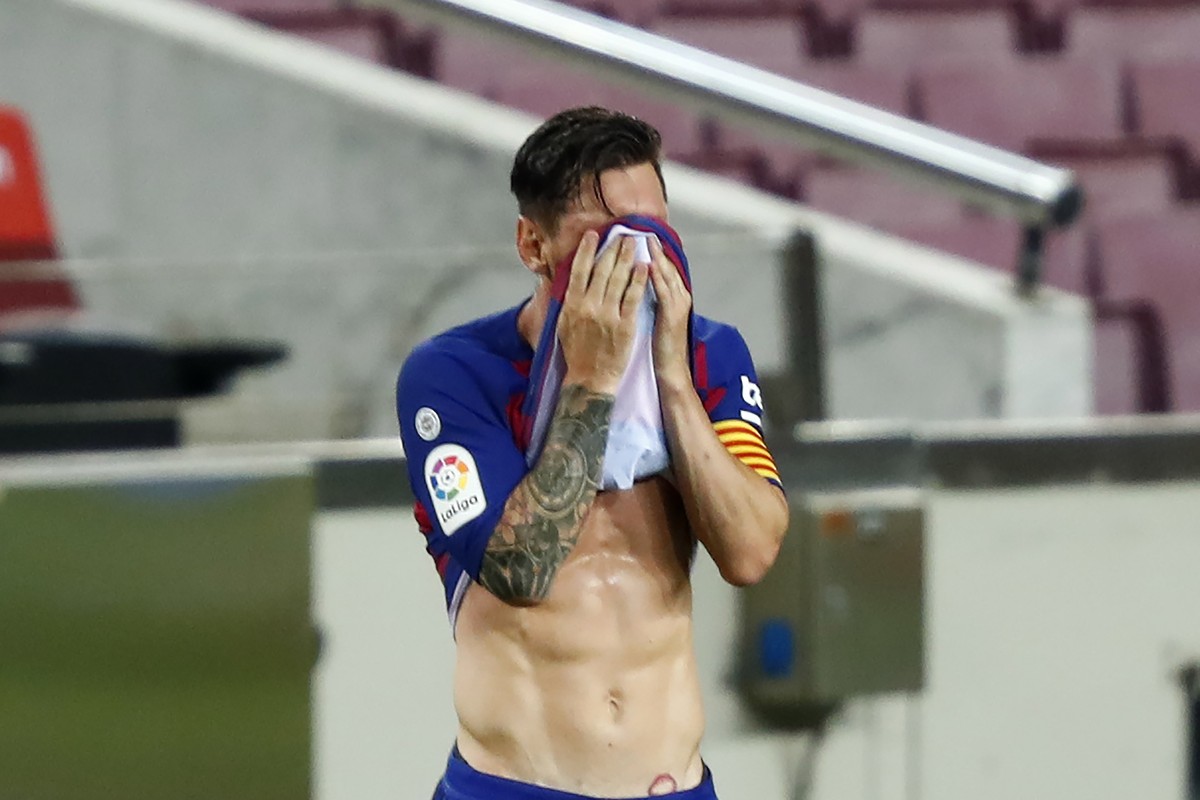 Barcelona's Lionel Messi reacts during a Spanish La Liga soccer match between Barcelona and Osasuna at the Camp Nou stadium in Barcelona, Spain, Thursday, July 16, 2020. (AP Photo/Joan Monfort)