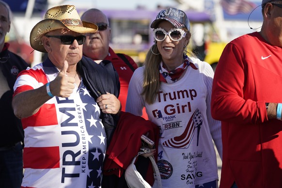 Supporters arrives before former President Donald Trump speaks at a rally in support of the campaign of Ohio Senate candidate JD Vance at Wright Bros. Aero Inc. at Dayton International Airport on Mond ...