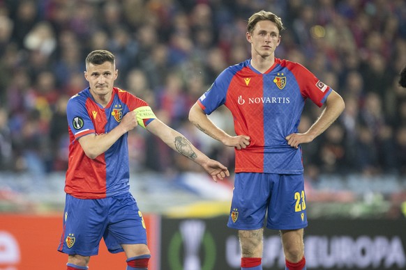 epa10637497 Basel's Taulant Xhaka, left, reacts next to Wouter Burger during the UEFA Conference League semifinal second leg match between Switzerland's FC Basel 1893 and Italy's ACF Fi ...