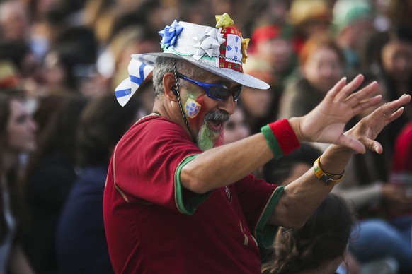 epa05365216 A supporter of Portugal during the public viewing of the UEFA EURO 2016 group F preliminary round match between Portugal and Iceland at Terreiro do Paco in Lisbon, Portugal, 14 June 2016.  ...