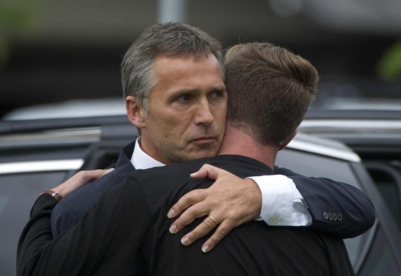 FILE - In this Saturday, July 23, 2011 file photo, Norway&#039;s Prime Minister Jens Stoltenberg, left, embraces the leader of the Labour party&#039;s youth group Eskild Pedersen who was on the island ...