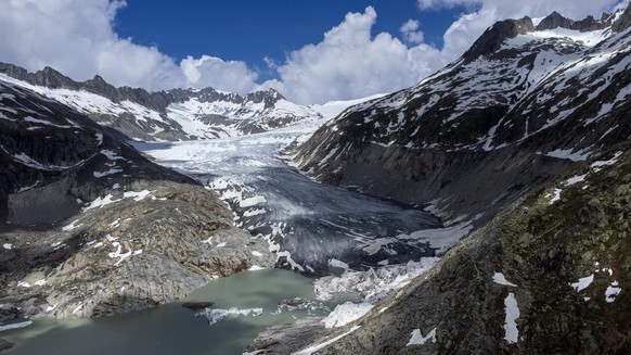 FILE - A lake of meltwater has formed on the tongue of the Rhone Glacier near Goms, Switzerland, on June 13, 2023. Europe is the fastest-warming continent and its temperatures are rising at roughly tw ...