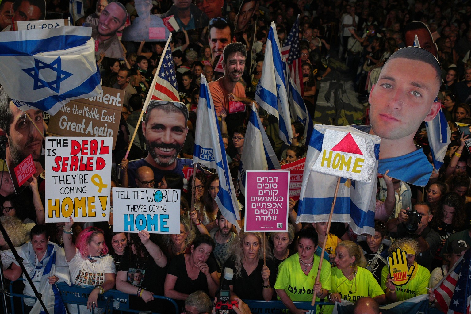 People part in a rally in support of hostages kidnapped by Hamas, at a plaza known as hostages square, in Tel Aviv, Israel, Saturday, Oct. 11, 2025, ahead of the expected release of the hostages held  ...