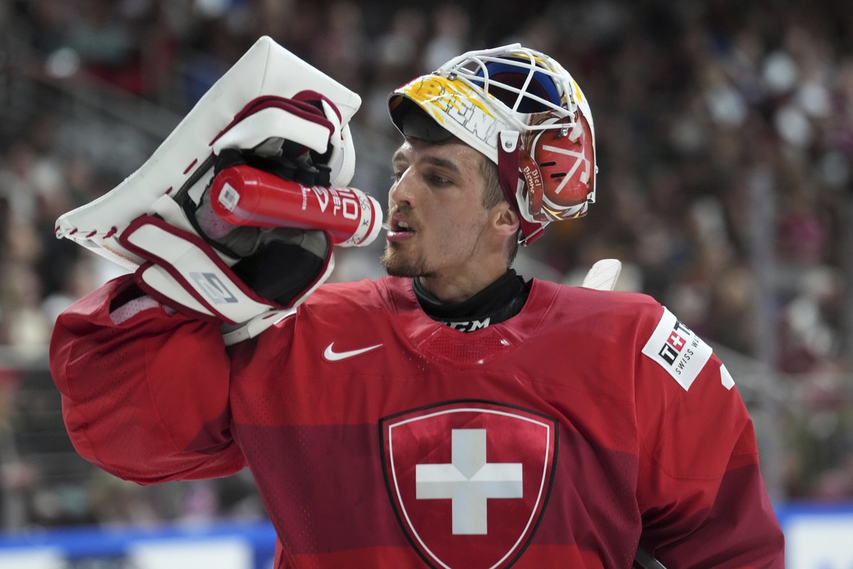 Goalie Joren Pottelberghe of Switzerland drinks during the group B match between Latvia and Switzerland at the ice hockey world championship in Riga, Latvia, Tuesday, May 23, 2023. (AP Photo/Roman Kok ...