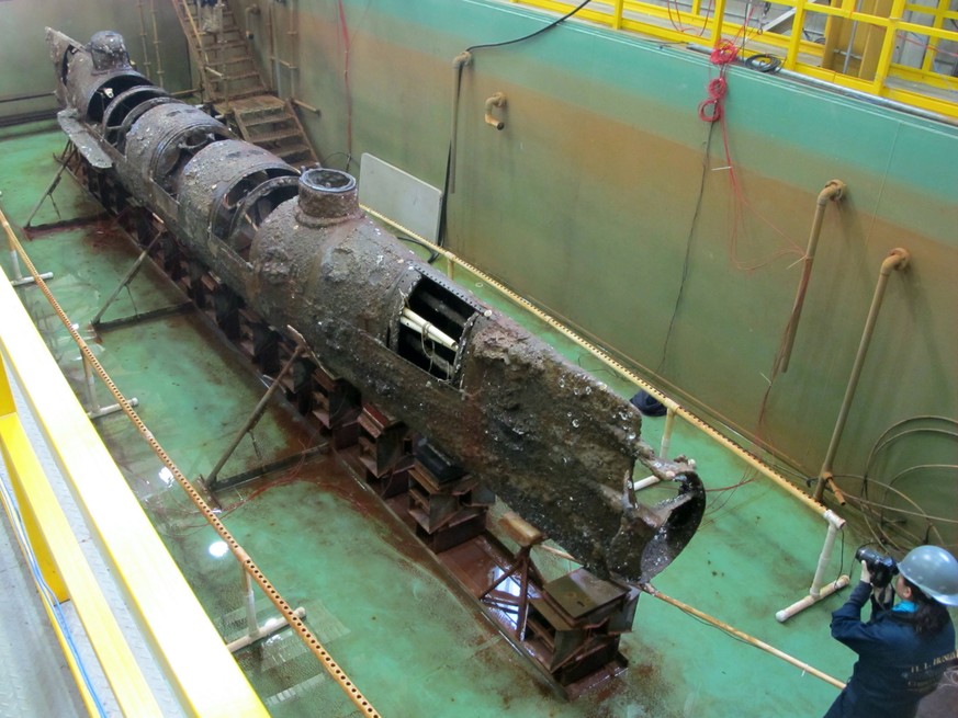 FILE - The Confederate submarine H.L. Hunley sits in a conservation tank after a steel truss that had surrounded it was removed in this Jan. 12, 2012, file photo, taken at a conservation lab in North  ...