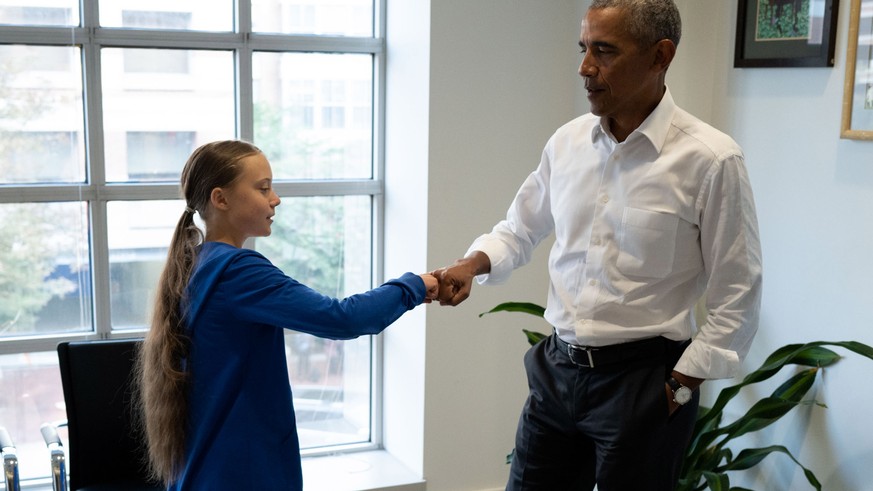 epa07850765 A handout photo made available by The OBama Foundation shows former US President Barack Obama meeting with Greta Thunberg, the 16 year old climate change activist from Sweden, in Washingto ...
