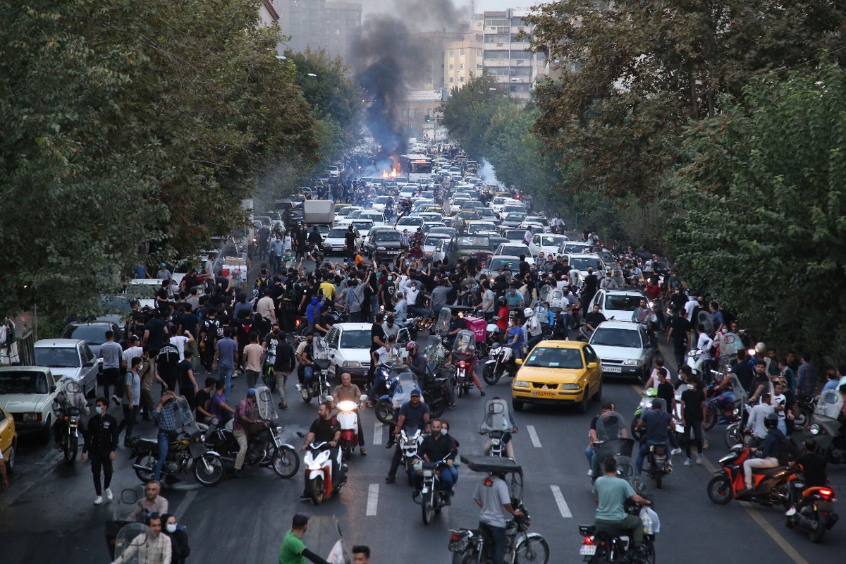 epa10197708 People clash with police during a protest following the death of Mahsa Amini, in Tehran, Iran, 21 September 2022. Mahsa Amini, a 22-year-old Iranian woman, was arrested in Tehran on 13 Sep ...