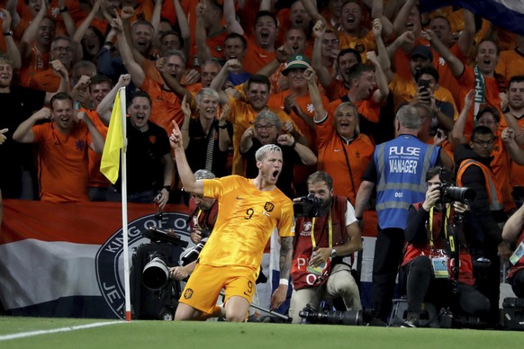 Netherlands&#039; Wout Weghorst celebrates after scoring their sides second goal during the Euro 2024 Group C qualifying soccer match between Ireland and Netherlands at the Aviva Stadium, Dublin, Irel ...