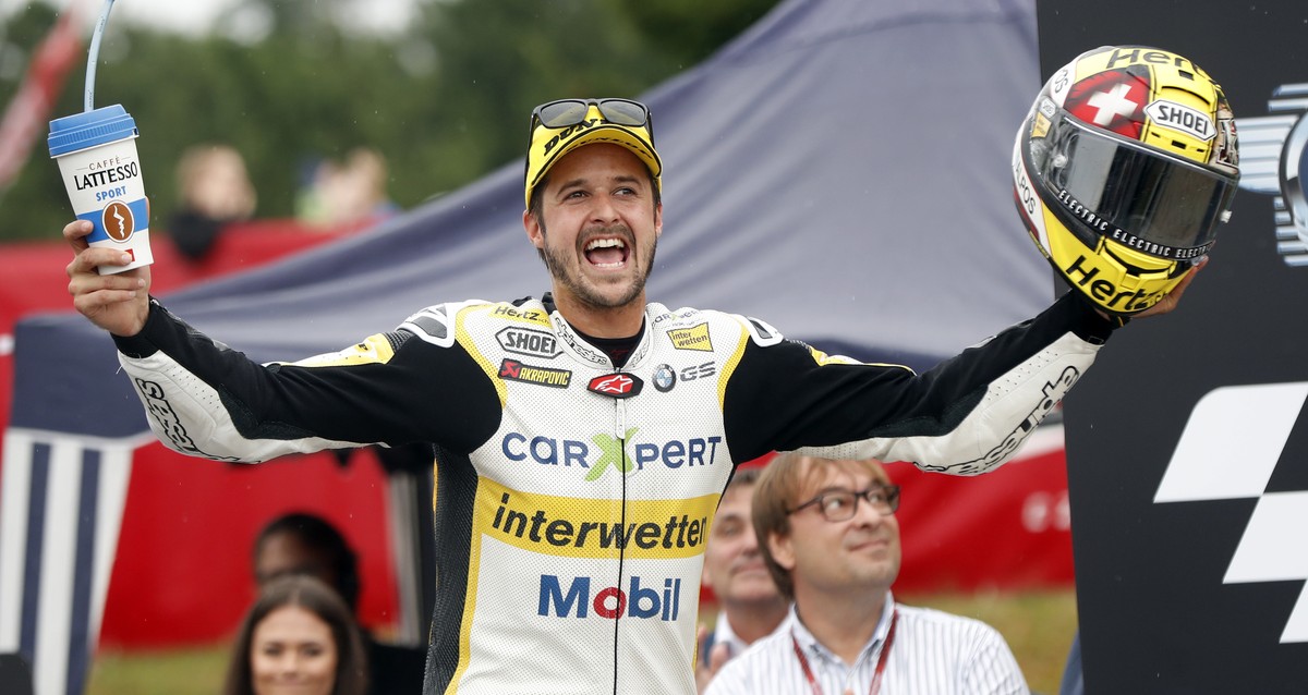 Switzerland's Moto2 rider Thomas Luthi of the CarXpert Interwetten celebrates his victory in the Moto2 race at the Czech Republic motorcycle Grand Prix at the Automotodrom Brno, in Brno, Czech Re ...