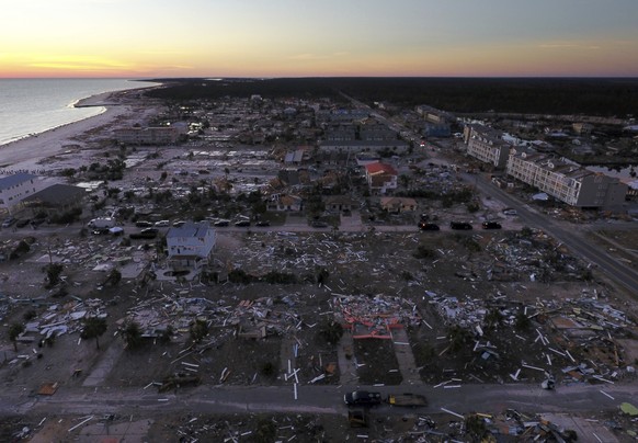 FILE - In this Oct. 12, 2018, file photo, damaged homes are seen along the water&#039;s edge in the aftermath of hurricane Michael in Mexico Beach, Fla. It was once argued that the trees would help sa ...