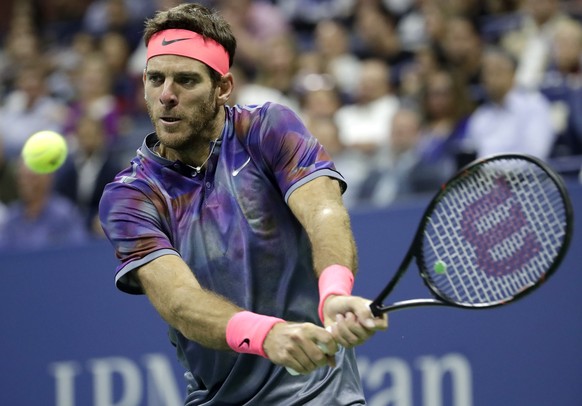 Juan Martin del Potro, of Argentina, hits a backhand to Roger Federer, of Switzerland, during the quarterfinals of the U.S. Open tennis tournament, Wednesday, Sept. 6, 2017, in New York. (AP Photo/Jul ...