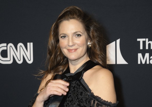 FILE - Drew Barrymore appears at the 24th Annual Mark Twain Prize for American Humor at the Kennedy Center for the Performing Arts on March 19, 2023, in Washington. Barrymore will host the National Bo ...