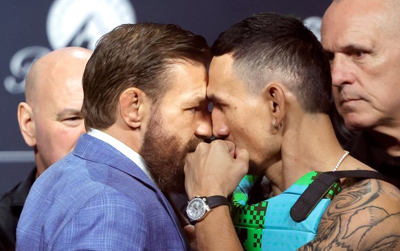 UFC welterweight fighters Conor McGregor, left, and Max Holloway face off during a news conference for the UFC 329 mixed martial arts event, Thursday, July 9, 2026, in Las Vegas. (Steve Marcus/Las Veg ...