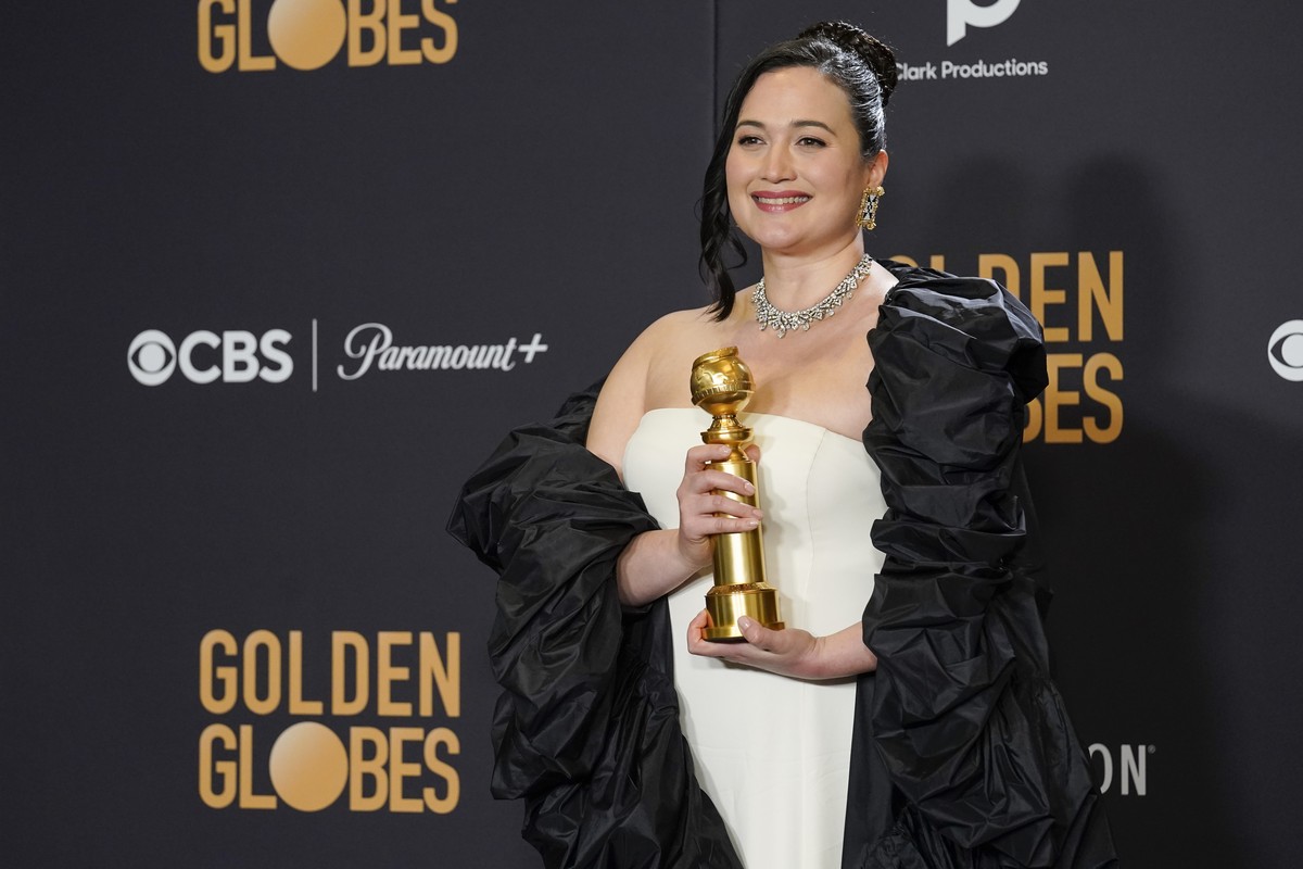 Lily Gladstone poses in the press room with the award for best performance by an actress in a motion picture, drama for "Killers of the Flower Moon" at the 81st Golden Globe Awards on Sunday ...