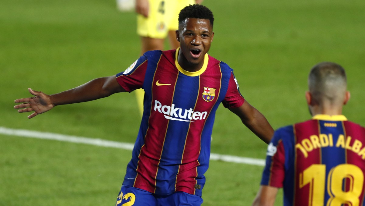 Barcelona's Ansu Fati celebrates scoring the opening goal during the Spanish La Liga soccer match between FC Barcelona and Villareal FC at the Camp Nou stadium in Barcelona, Spain, Sunday, Sept.  ...