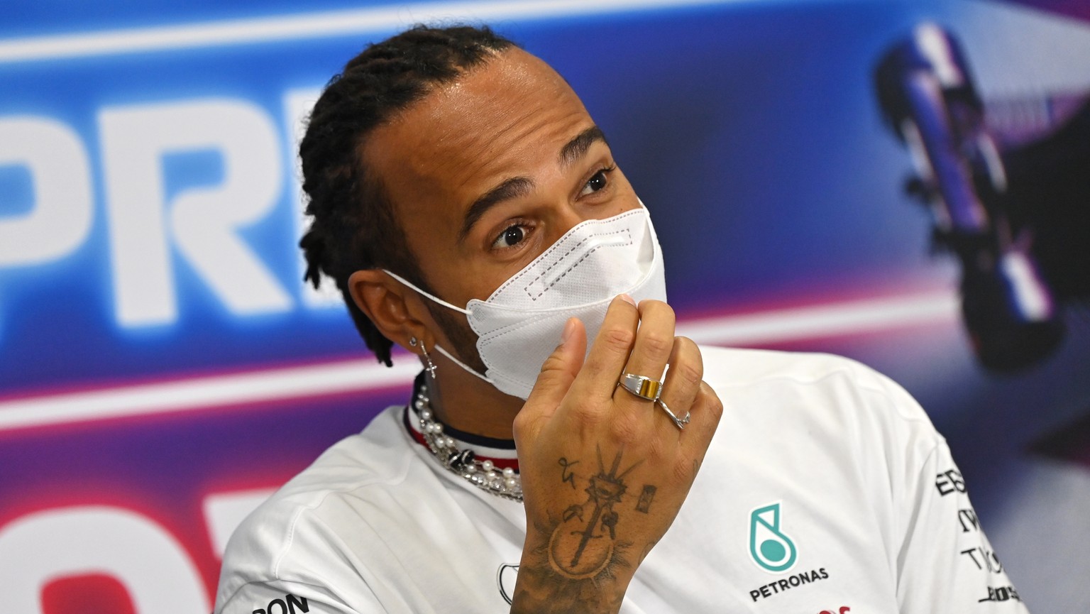 epa09589518 British Formula One driver Lewis Hamilton of Mercedes-AMG Petronas attends the press conference for the 2021 Formula One Grand Prix of Qatar at the Losail International Circuit in Lusail,  ...