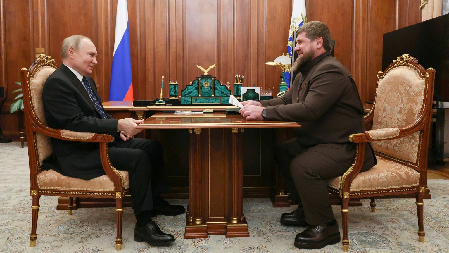 Russian President Vladimir Putin listens to Chechnya Regional Leader Ramzan Kadyrov during their meeting at the Kremlin in Moscow, Russia, Monday, March 13, 2023. (Mikhail Klimentyev, Sputnik,…