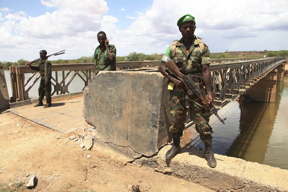 African Union troops guard a bridge over the Juba river, near the town of Burdubow, in the Gedo region of Somalia, in this March 14, 2014 photo supplied by the AU/UN Information Support Team. African  ...