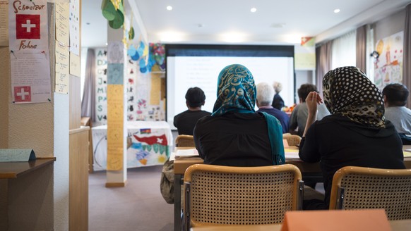 Asylum seekers at school, taken during a media conference with a tour of the Bergruh Center for Asylum Seekers, on Tuesday, May 31, 2016, in Amden.  Since January 2016, 80 asylum seekers have...
