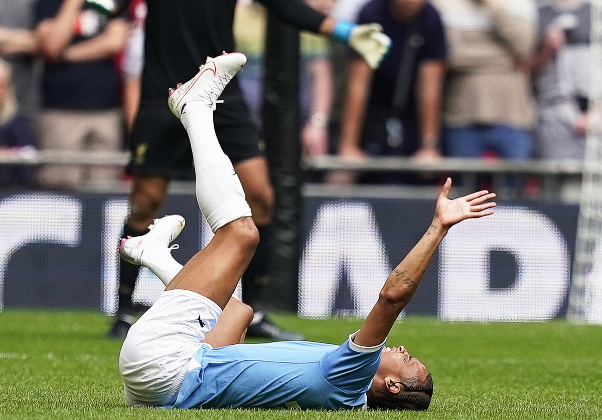 epa07762185 (FILE) - Manchester City's Leroy Sane reacts after being injured during the FA Community Shield soccer match between Liverpool FC and and Manchester City at Wembley Stadium in London, ...