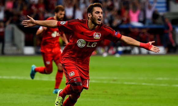LEVERKUSEN, GERMANY - AUGUST 26: Hakan Calhanoglu of Bayer Leverkusen celebrates after scoring his teams first goal during the UEFA Champions League qualifying play off round 2nd leg between Bayer Lev ...