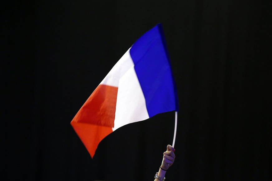 epa05908139 Supporters of Francois Fillon wave French flags during a political rally of French presidential election candidate for Les Republicains (LR) party Fillon in Montpellier, France, 14 April 2 ...