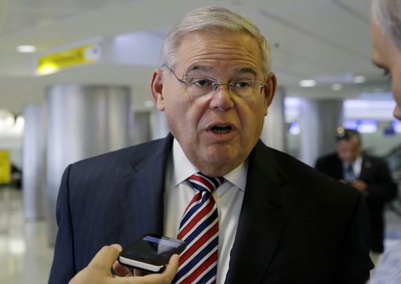 FILE - In this June 15, 2015, file photo, Sen. Bob Menendez, D-N.J., speaks with reporters at Newark Liberty Airport in Newark, NJ.  The September vote on the Iran nuclear deal is being billed as a giant step...