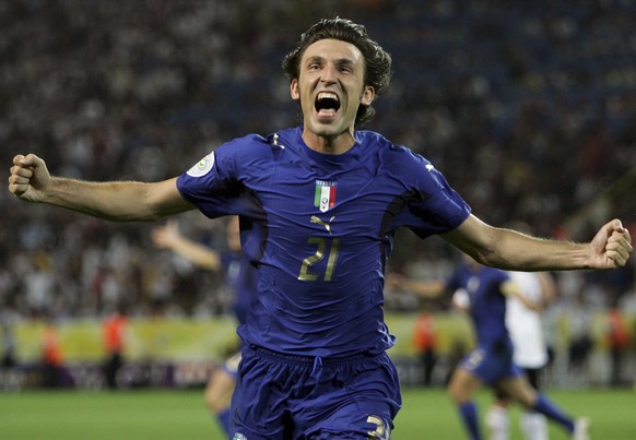 FILE - In this Tuesday, July 4, 2006 filer, Italy's Andrea Pirlo celebrates his side's first goal by teammate Fabio Grosso in the extra time of the semifinal World Cup soccer match between G ...