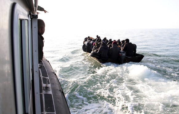 FILE - Migrants, mainly from sub-Saharan Africa, are stopped by Tunisian Maritime National Guard at sea during an attempt to get to Italy, near the coast of Sfax, Tunisia, on April 18, 2023. (AP Photo ...