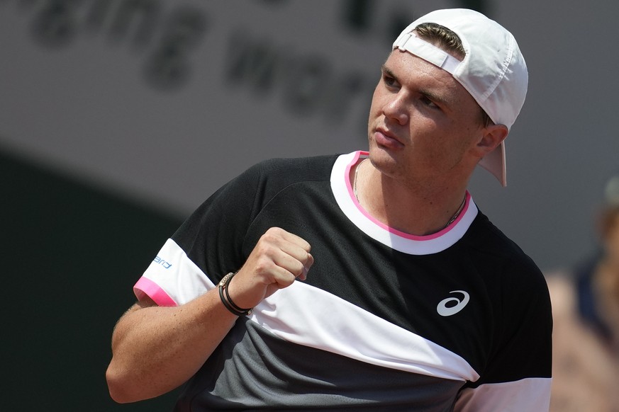 Switzerland&#039;s Dominic Stephan Stricker clenches his fist after scoring a point against Tommy Paul of the U.S. during their first round match of the French Open tennis tournament at the Roland Gar ...