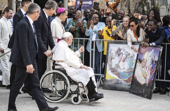 Pope Francis greets well-wishers before meeting with bishops in Kinshasa, Congo, Friday Feb. 3, 2023. Francis had one final appointment Friday in Kinshasa with Congo?s bishops before flying to the Sou ...