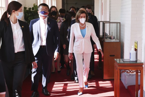 In this photo released by the Taiwan Legislative Yuan, U.S. House Speaker Nancy Pelosi, right, and Legislative Yuan Deputy Speaker Tsai Chi-chang arrive for a meeting in Taipei, Taiwan, Wednesday, Aug ...