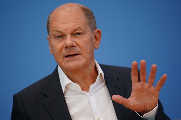 epa10115320 German Chancellor Olaf Scholz gestures during the beginning of a press conference at the Federal Press Conference (Bundespressekonferenz) in Berlin, Germany, 11 August 2022. The traditiona ...