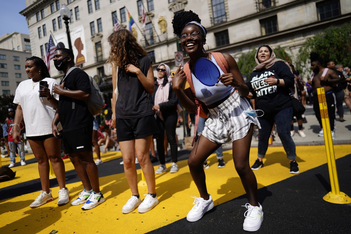 epa09287233 A member of the public dances as celebrations for 'Juneteenth' take place on Black Lives Matter Plaza, in Washington, DC, USA, 19 June 2021. 'Juneteenth' the celebratio ...