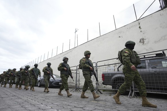 Police and soldiers prepare to enter El Inca prison to quell a riot in Quito, Ecuador, Monday, Jan. 8, 2024. The riot comes the day after Ecuadorian authorities reported that, at a different prison in ...