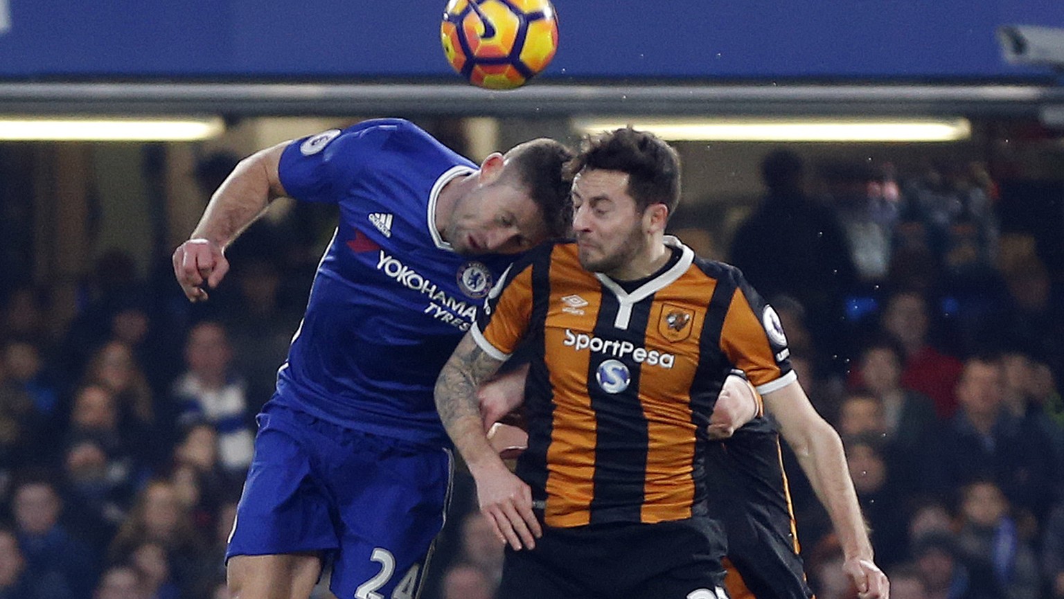 In this Sunday, Jan. 22, 2017 photo, Hull City&#039;s Ryan Mason, right, is injured during a header with Chelsea&#039;s Gary Cahill, left, during their English Premier League soccer match at Stamford  ...