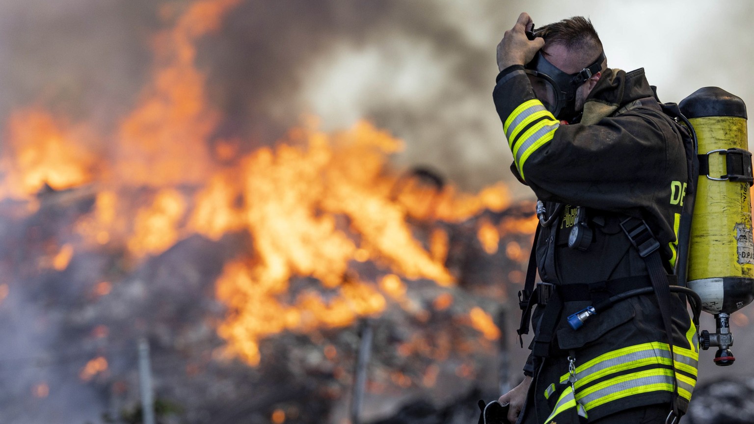 epa10775029 Firefighters work to extinguish a fire at a waste management facility near the Ciampino airport, in Rome, Italy, 29 July 2023. Extinguishing operations are underway as six teams of firefig ...