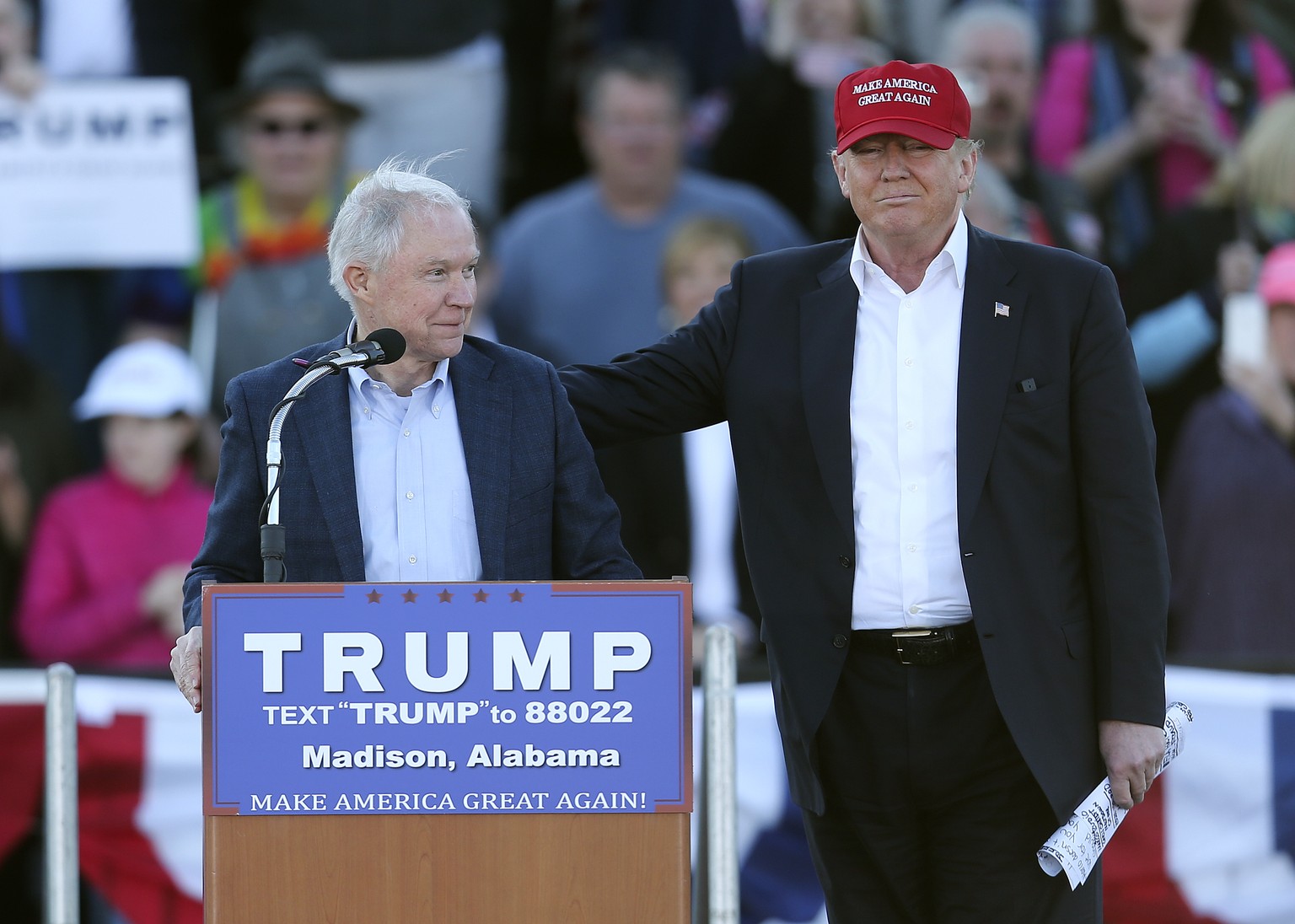 Republican presidential candidate Donald Trump, right, stands next to Sen. Jeff Sessions, R-Ala., as Sessions speaks during a rally Sunday, Feb. 28, 2016, in Madison, Ala. (AP Photo/John Bazemore)