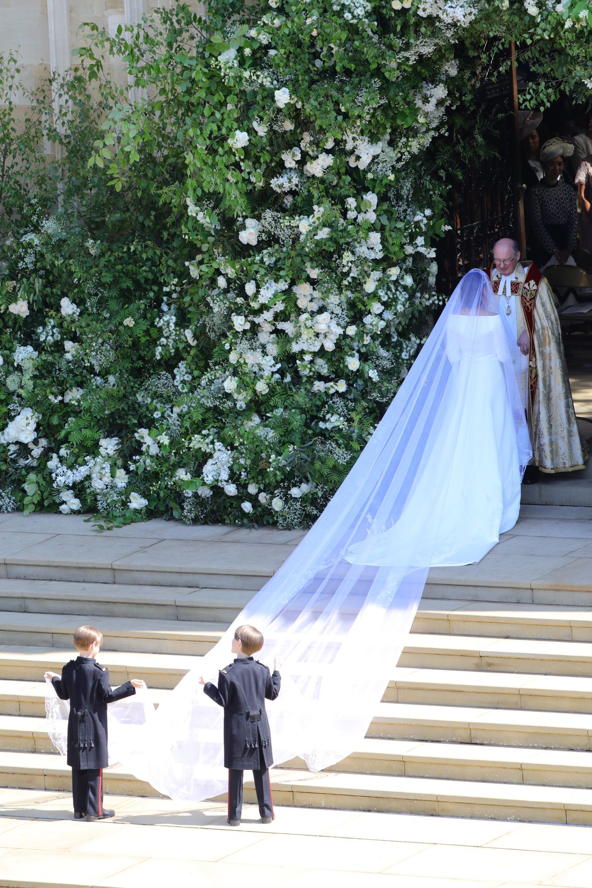 epa06749111 A handout photo made available by the British Ministry of Defence shows Meghan Markle arriving at her royal wedding ceremony with Britain's Prince Harry (unseen) at St George's C ...