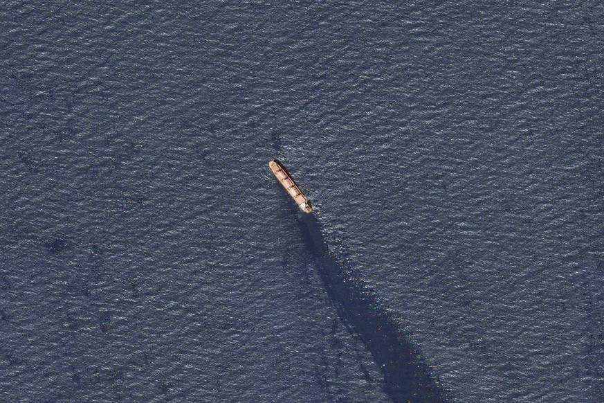 In this satellite image provided by Planet Labs, the Belize-flagged bulk carrier Rubimar in the southern Red Sea near the Gulf of Mandab Strait is seen leaking oil after an attack by Yemen's Houthis.