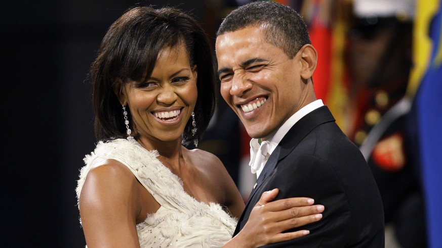 This Jan. 20, 2009 file photo shows President Barack Obama and first lady Michelle Obama at the Obama Home States Inaugural Ball in Washington. The two Harvard Law School grads met at the Chicago corp ...